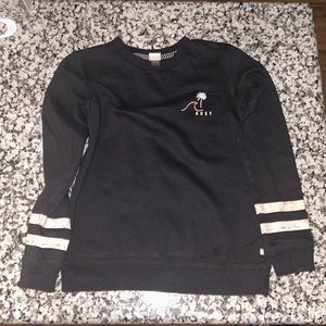 Roxy Girl Black with Roxy Logo on front, pink stripes on arms. Girls size 10.